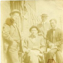 Four Unidentified Men